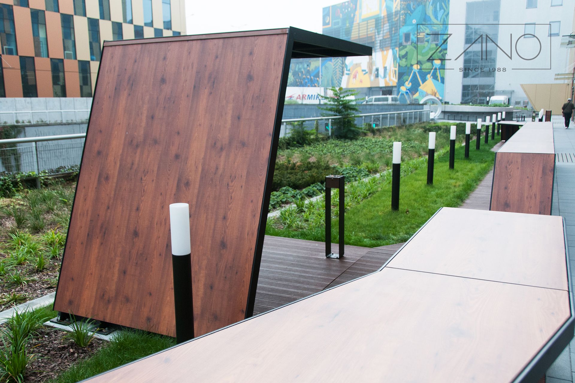 contemporary designed smoking shelter made of hpl, carbon steel and glass