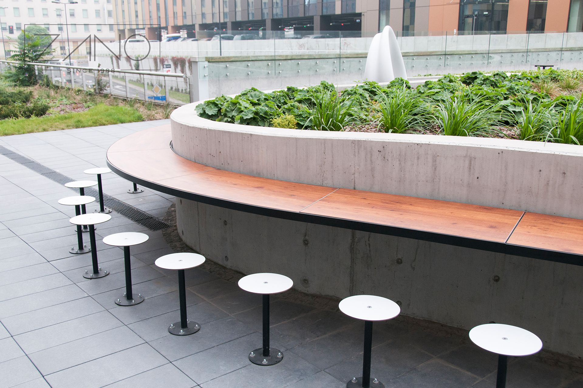 Outdoor table fixed to the concrete wall made of steel and high pressure laminate