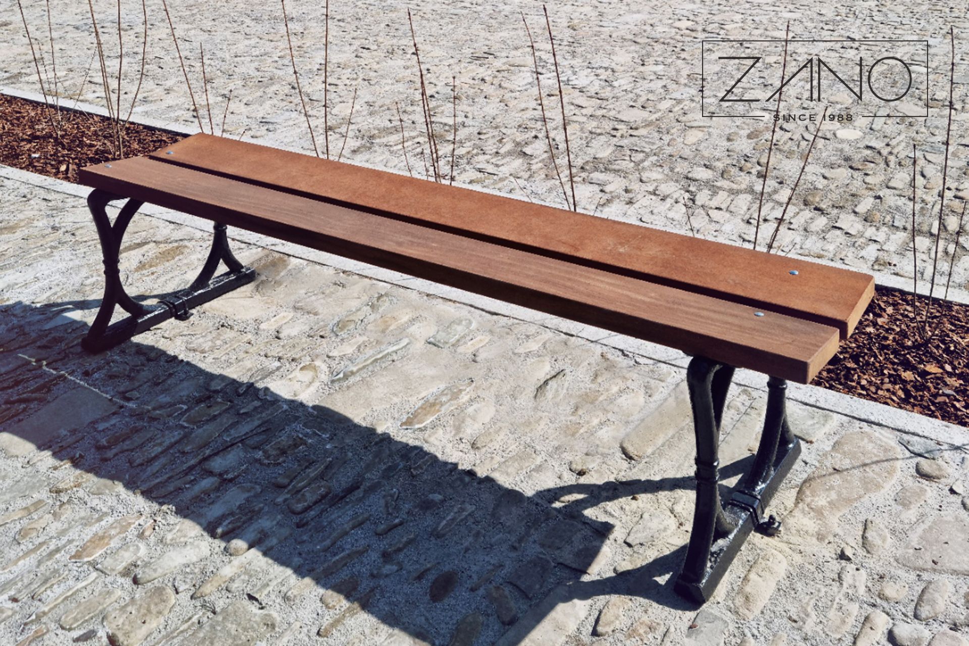 Retro cast iron bench with wooden seat protected by varnishing